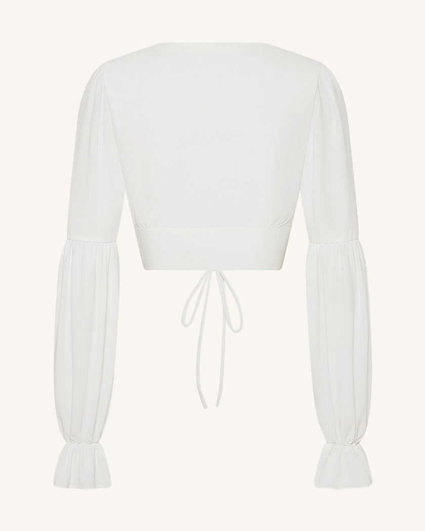 Sandra Blusa corta de chiffon con manga farol y lazo frontal blanca detalle del lazo frontal