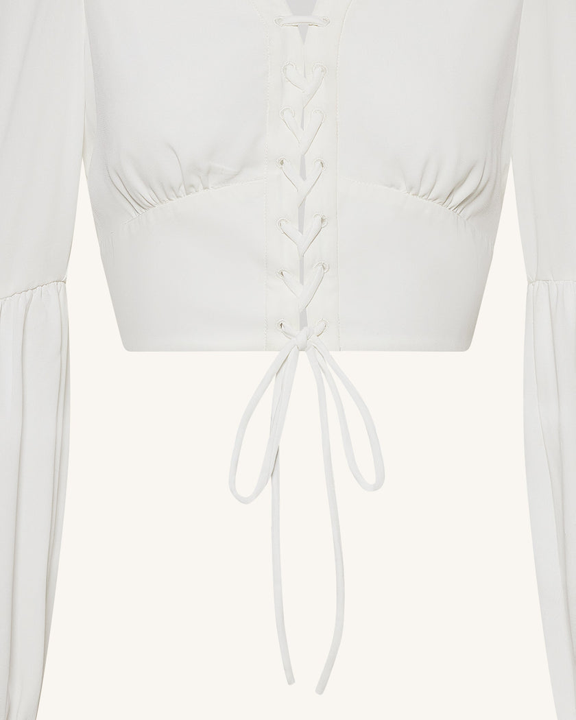 Sandra Blusa corta de chiffon con manga farol y lazo frontal blanca look femenino elegante