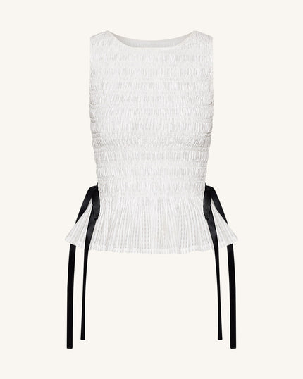 Zoe Top sin mangas peplum frunce elástico blanco vista lateral