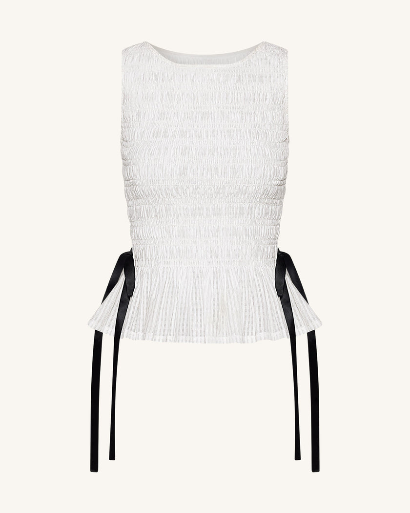 Zoe Top sin mangas peplum frunce elástico blanco vista lateral