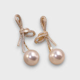 Celinea – Golden Bow Stud Earrings with Luminous Pearl